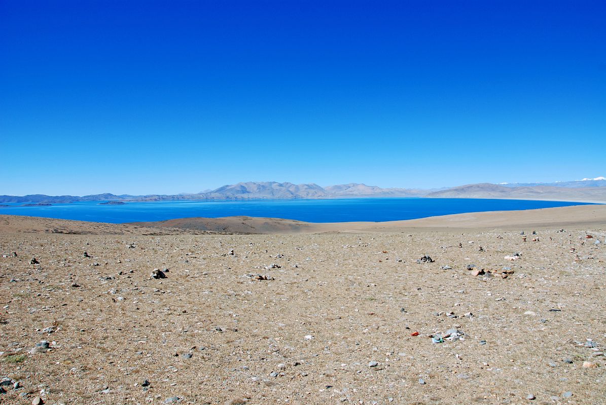 30 Lake Rakshas Tal From Ridge Between Lake Manasarovar And Lake Rakshas Tal To the west of Lake Manasarovar is Lake Rakshas Tal, shaped like a crescent, but thought of as darkness as opposed to the brightness of Manasarovar.